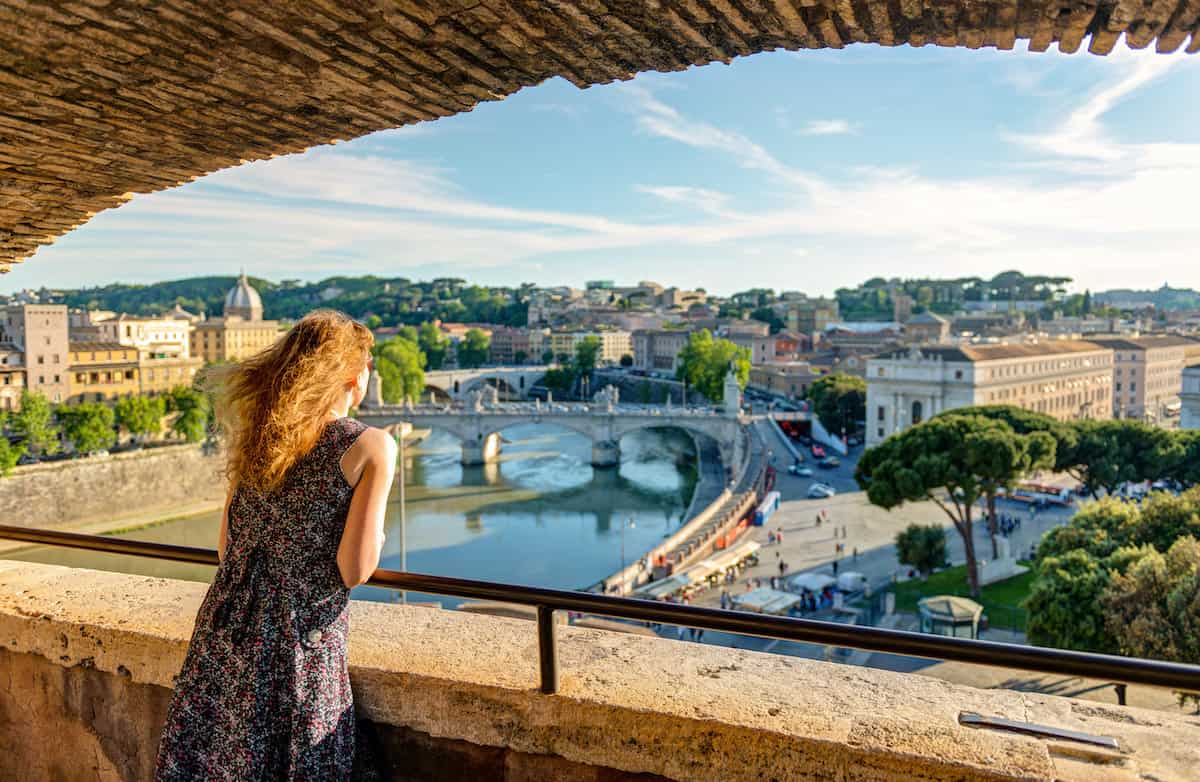 Girl tourist looks at Rome from above