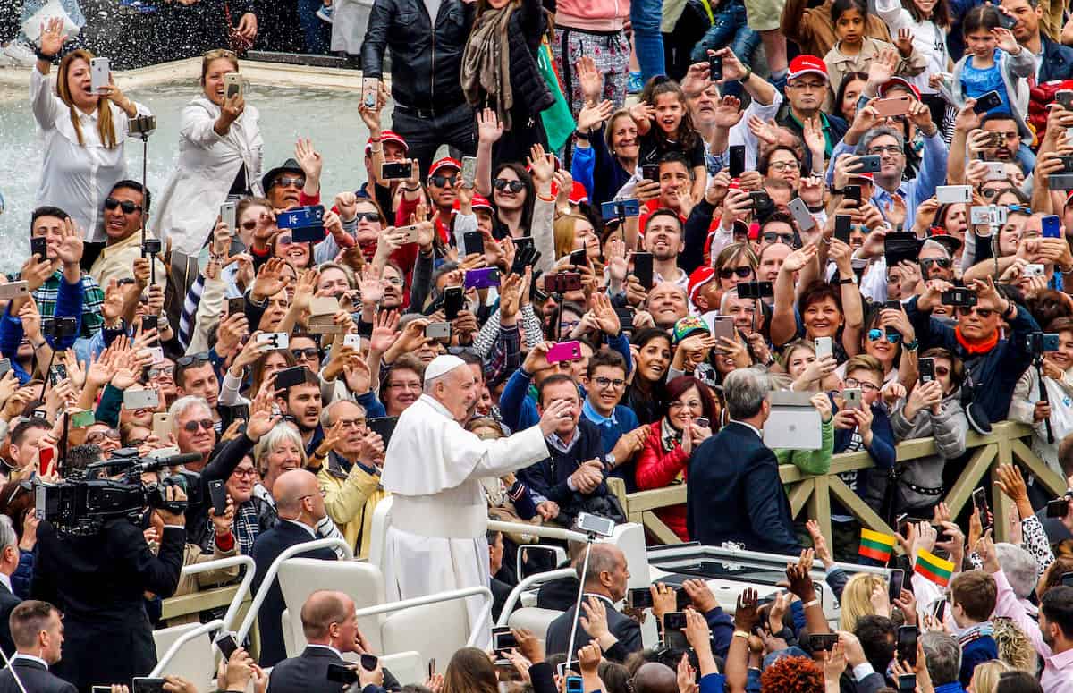 Pope Francis greets the faithful at the end of the Easter mass in St. Peter's Square.